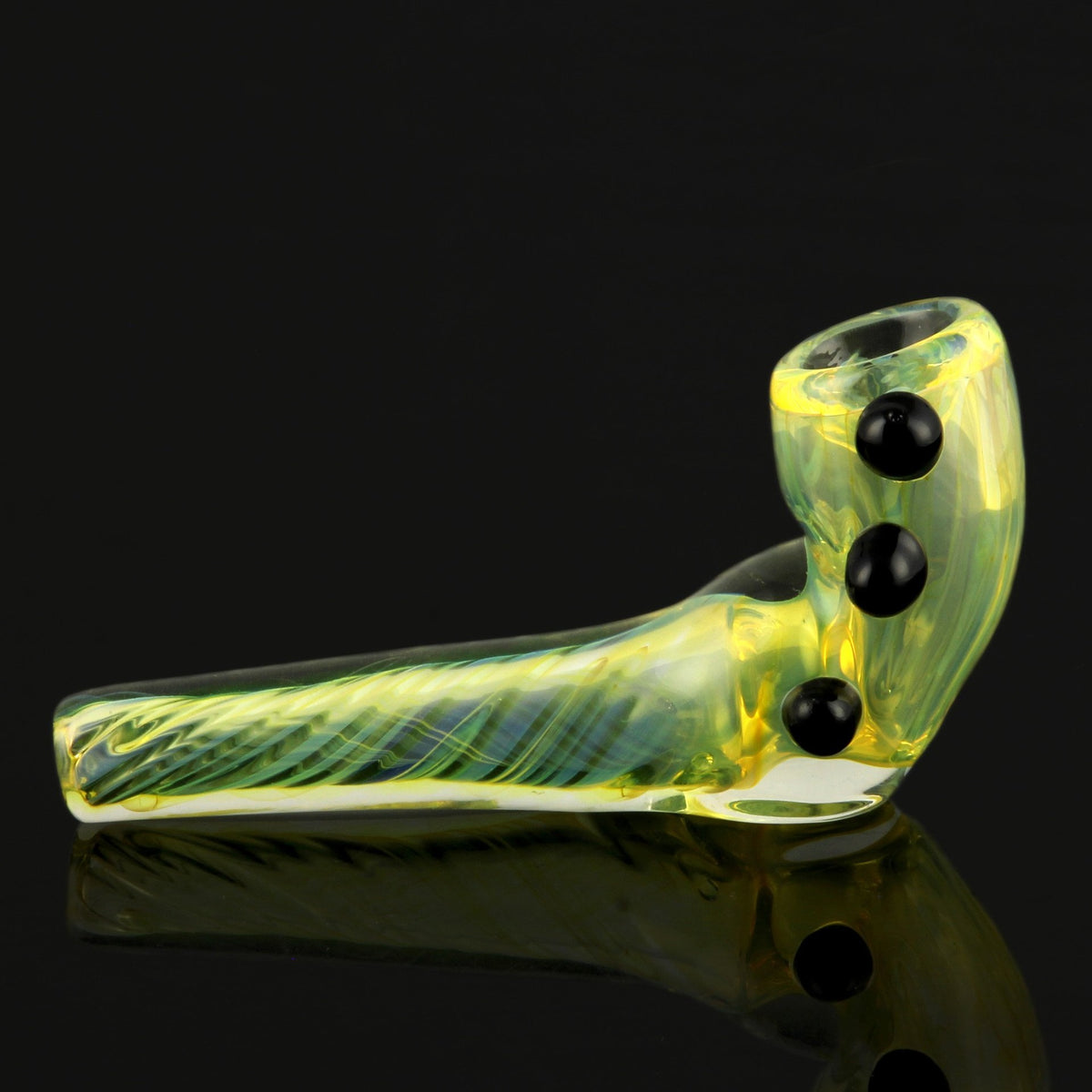 Green glass cannabis pipe with black accents, studio shot.