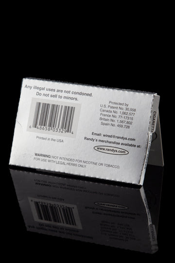 Close-up of a box of Randy's cigarette rolling papers with legal disclaimers and website address visible. - Randy's Classic Wired Rolling Papers