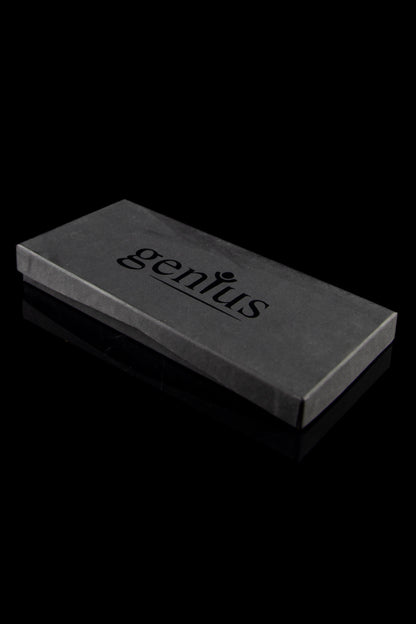 Black box with “genius” printed in white, likely containing a cannabis accessory.