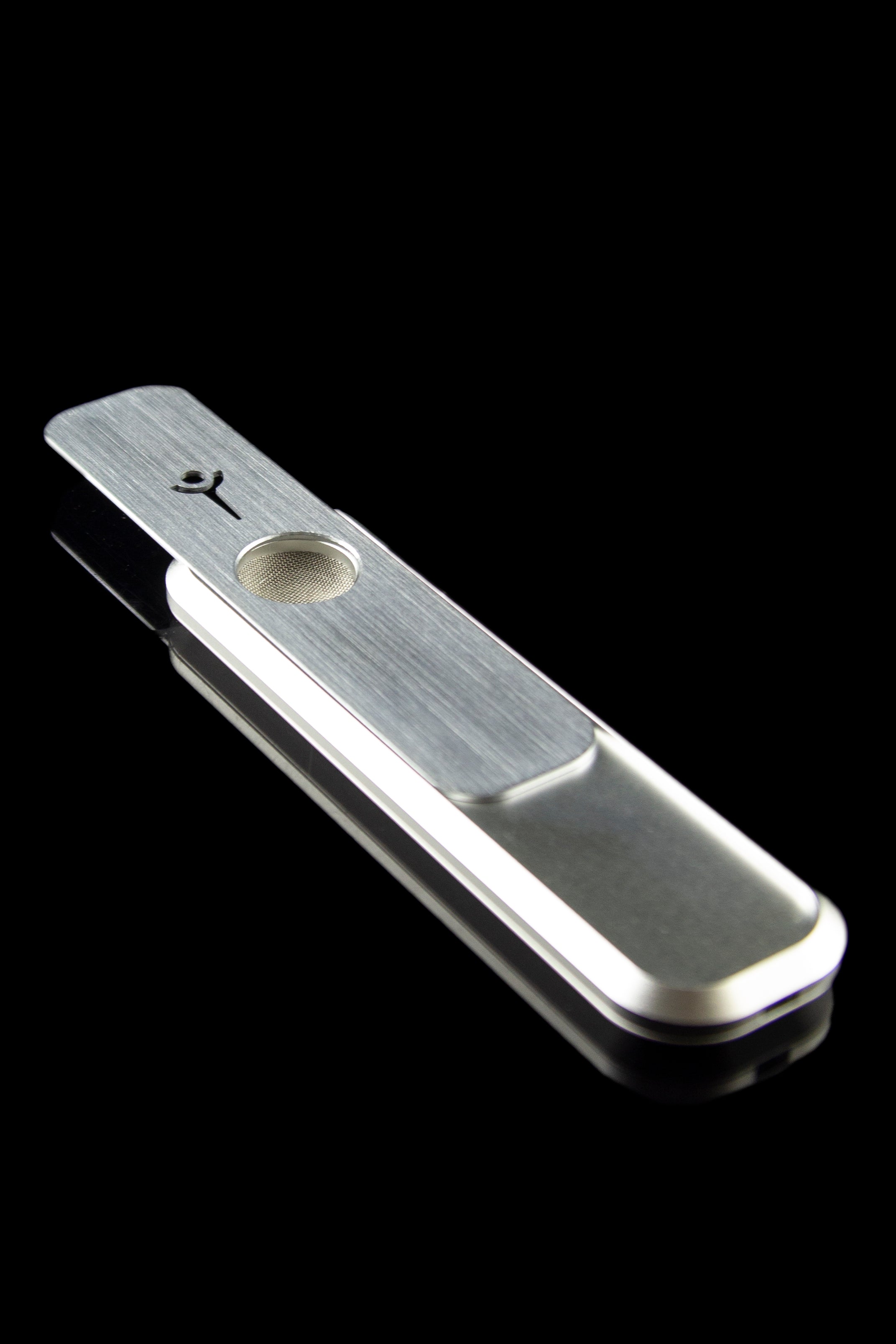 Silver pipe for smoking cannabis, studio shot on black.