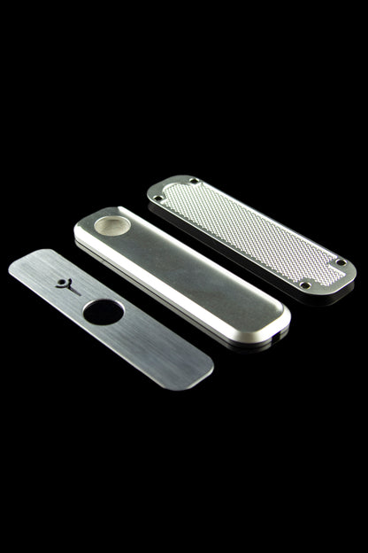 Silver cannabis pipe disassembled into three parts on a black background.