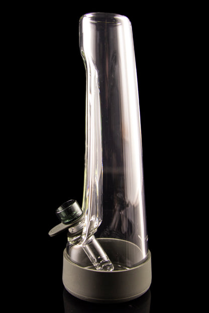 Clear glass bubbler water pipe with a black base, isolated on a black background.