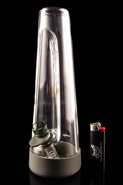 Clear glass bubbler with a green mouthpiece and lighter beside it, against a black background.