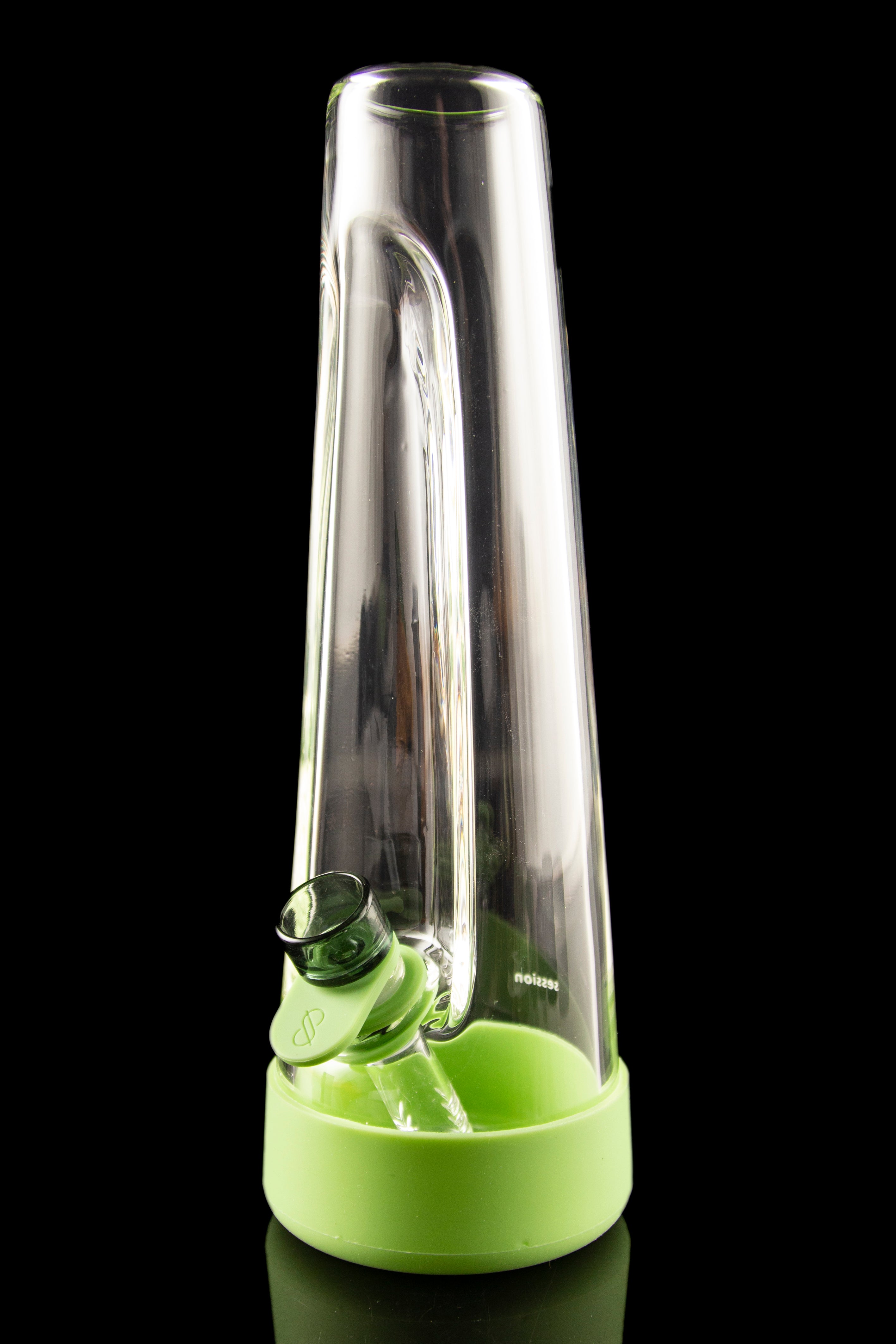 Green glass water pipe (rig) with a silicone base, studio shot.