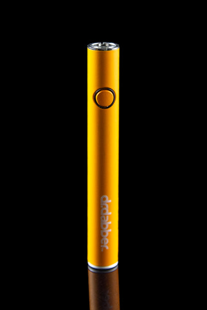Orange cannabis vape pen with "ddabber" logo, studio shot.