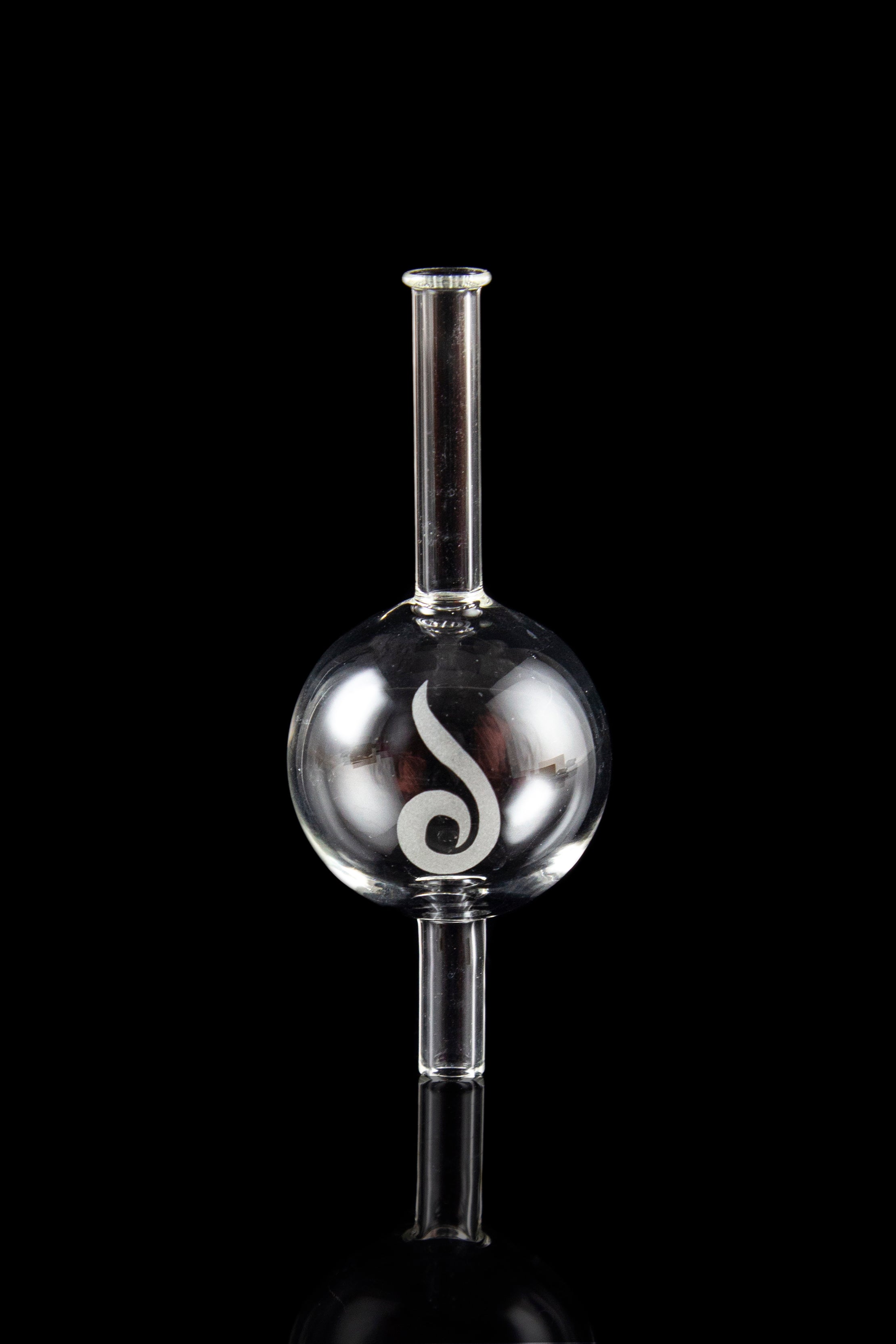 Glass oil rig with spherical water chamber and intricate white design, reflected on a dark surface.