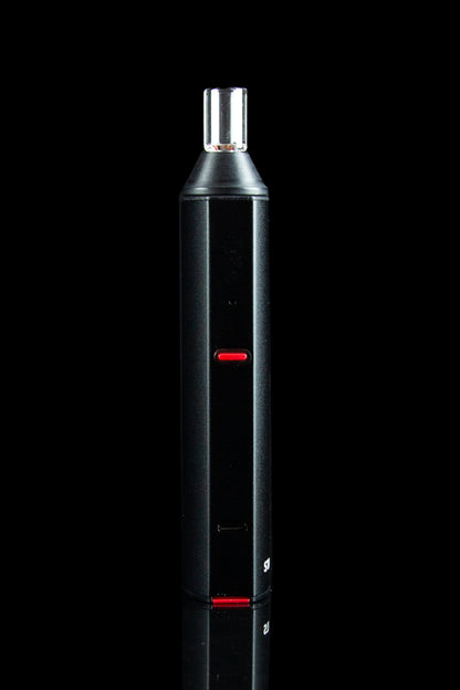 Black cannabis vaporizer pen with red indicator lights against a dark background.