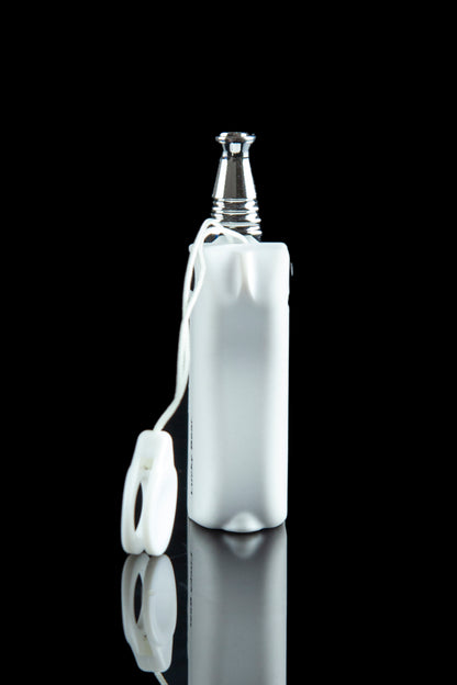 White silicone sleeve protecting a glass pipe, reflecting on a black surface.
