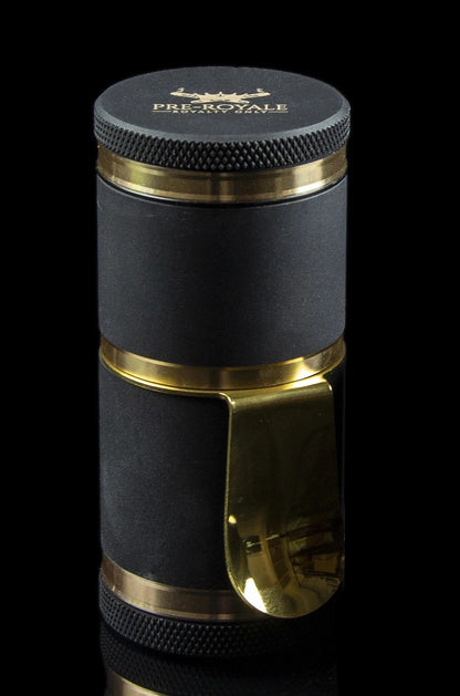Black and gold cannabis grinder with textured grip and branded top.