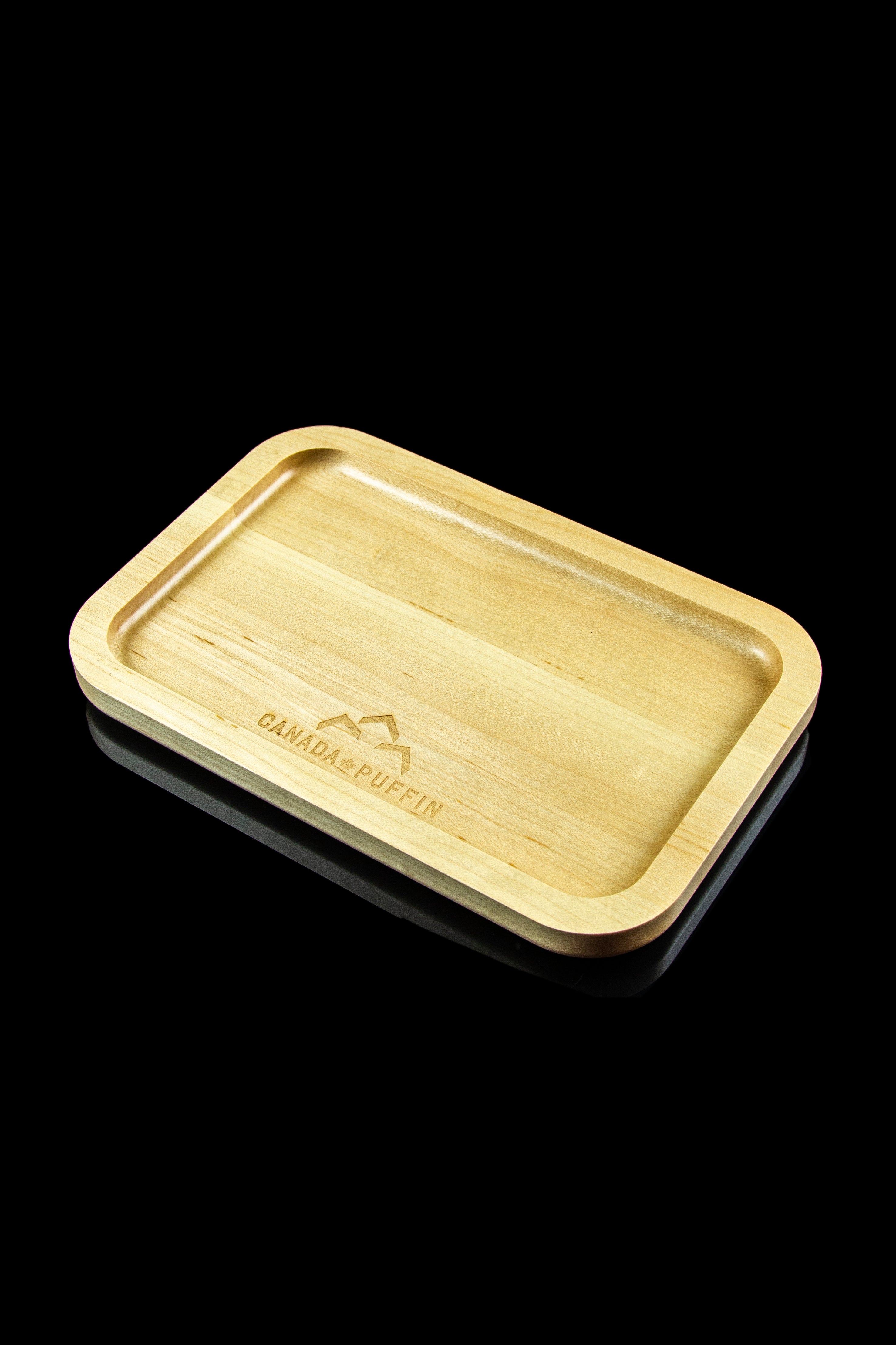 Wooden rolling tray with “Canada Puffin” logo, isolated on black.