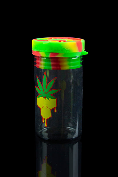 Glass cannabis jar with a colorful silicone lid and a marijuana leaf-shaped dripping honeycomb design.
