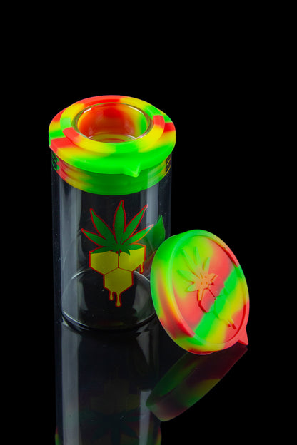 Colorful silicone cap and glass smoking piece with cannabis leaf design.