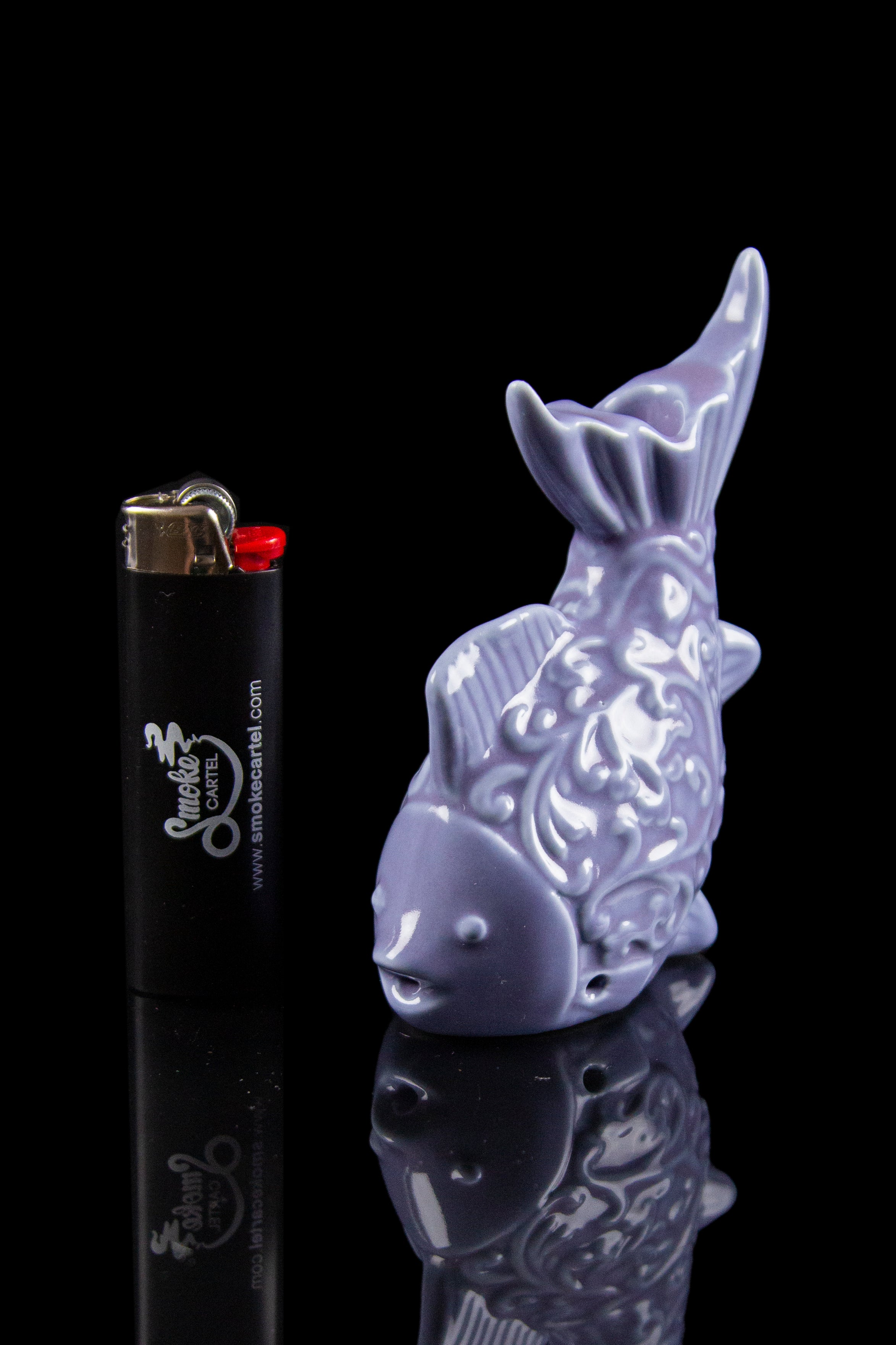 Purple glass bunny pipe with a black lighter featuring "Smoke Cartel" branding.