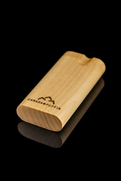 Wooden dugout with “Canada Puffin” logo against a black background.