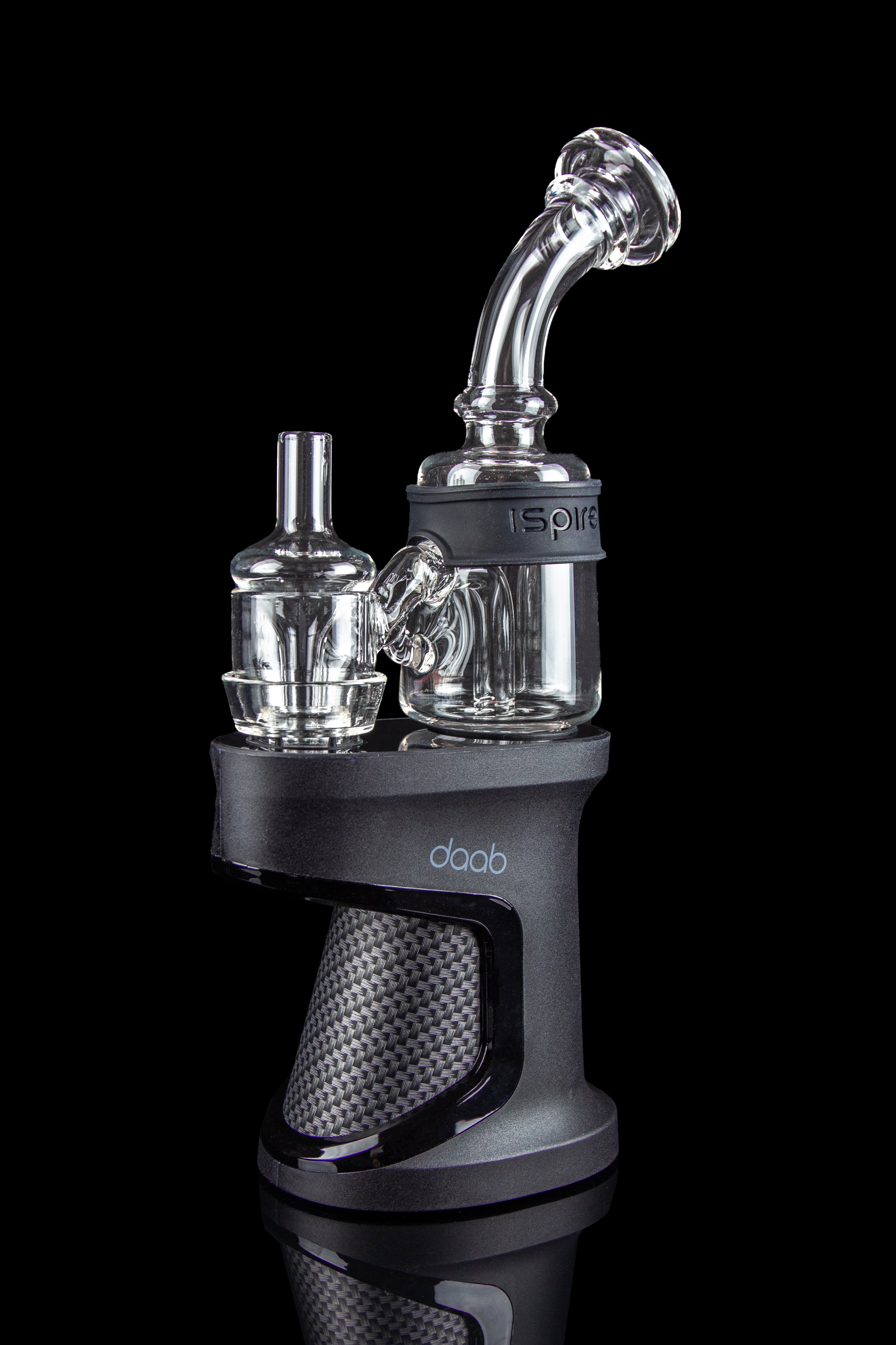 A close-up, angled view of the Ispire Daab E-Rig featuring a dark-colored base and a clear glass bubbler attachment.