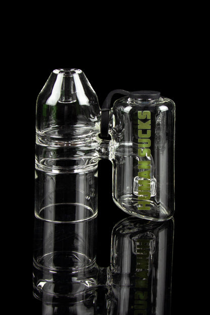 Clear glass bubbler water pipe with “HUMAN SUCKS” branding, stacked against a black background.