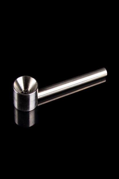 Silver cannabis oil burner pipe on a black reflective surface.