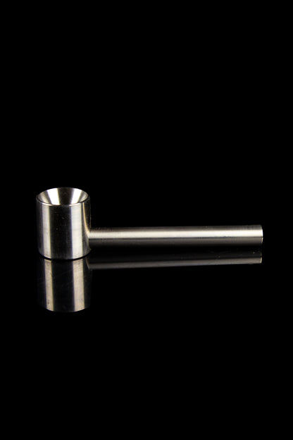 Silver one-hitter pipe with reflective surface against a black background.