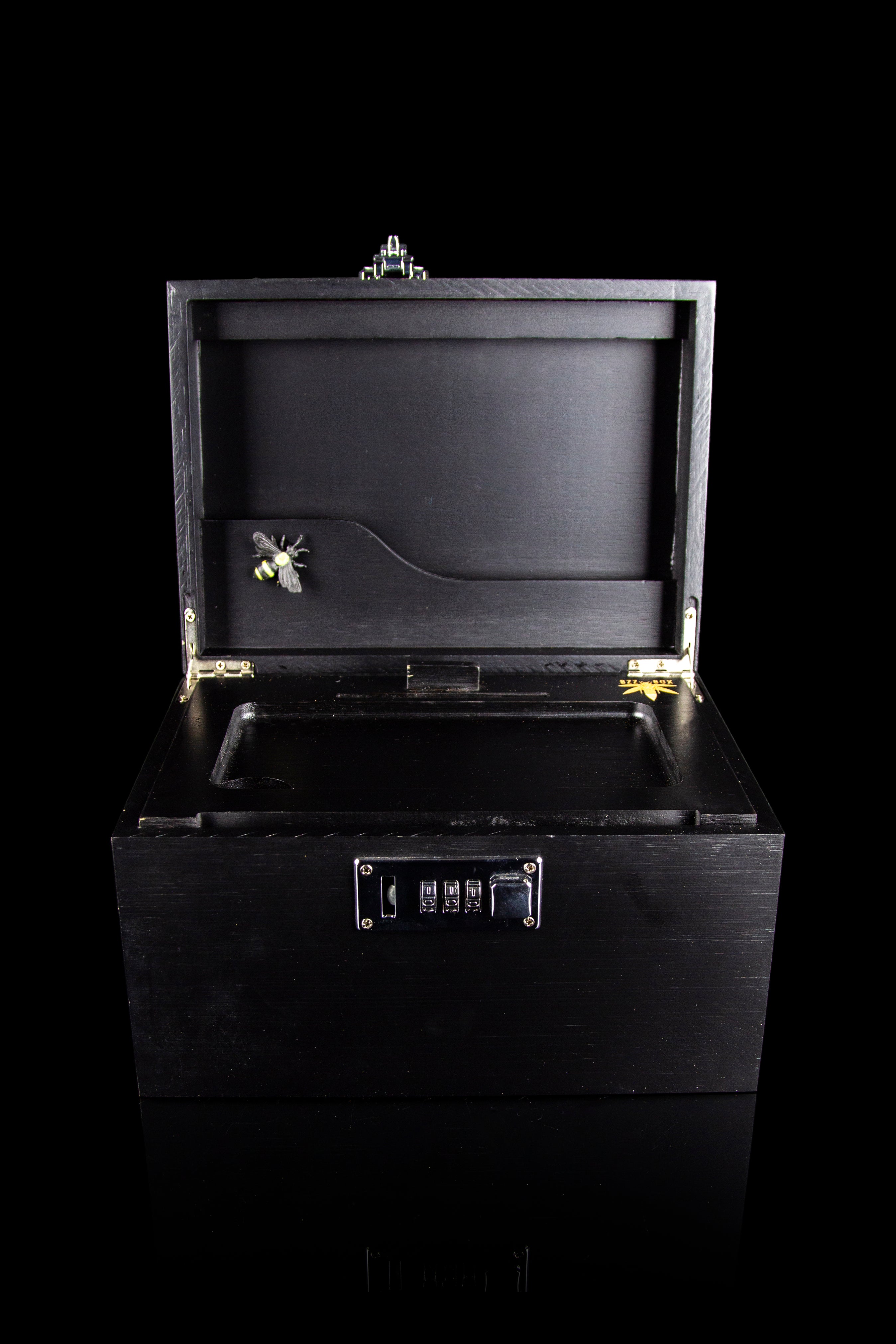Open black cannabis storage box with combination lock.