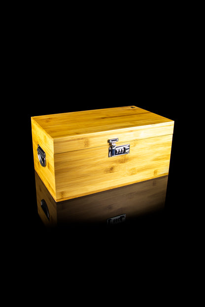 Wooden lockable storage box with combination lock, likely for cannabis or accessories, on a reflective black surface.