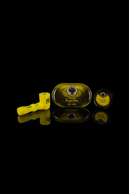 Cannabis oil syringe and branded cartridge packaging with reflective surface.