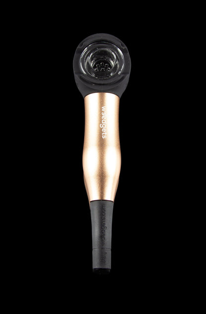 Rose gold glass pipe for smoking cannabis, isolated on a black background.