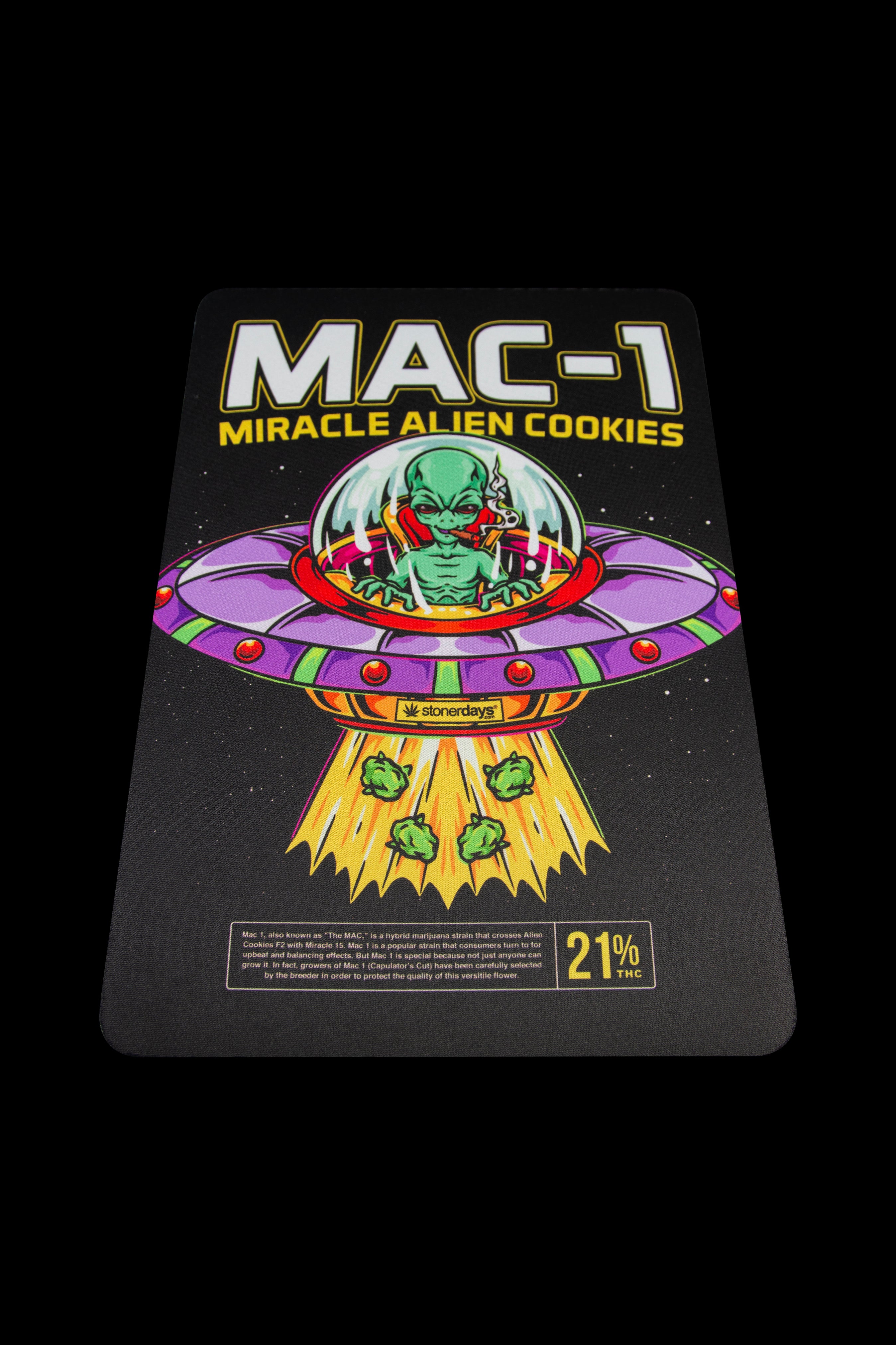 A product label for "Miracle Alien Cookies" (MAC-1) cannabis strain, featuring a vibrant UFO and alien graphic with a THC percentage of 21%.