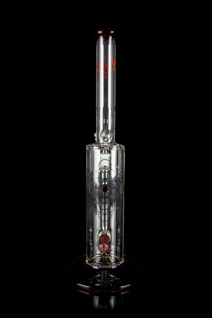 Glass water pipe (bong) with intricate etched design and red accents, isolated on a black background.