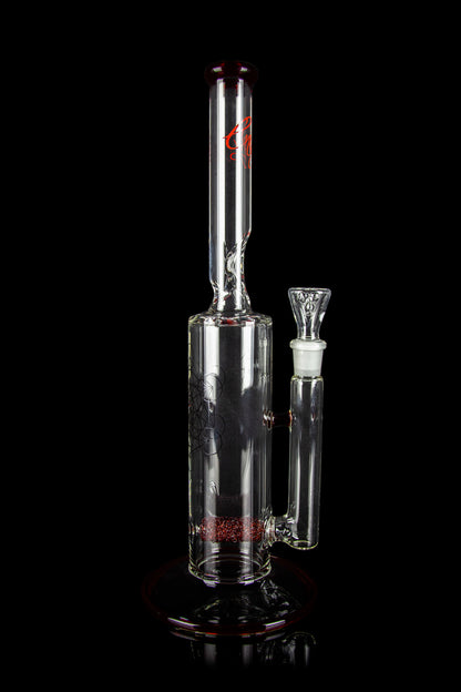 Clear glass water pipe (bong) with intricate etched designs and a translucent joint, isolated on a black background.