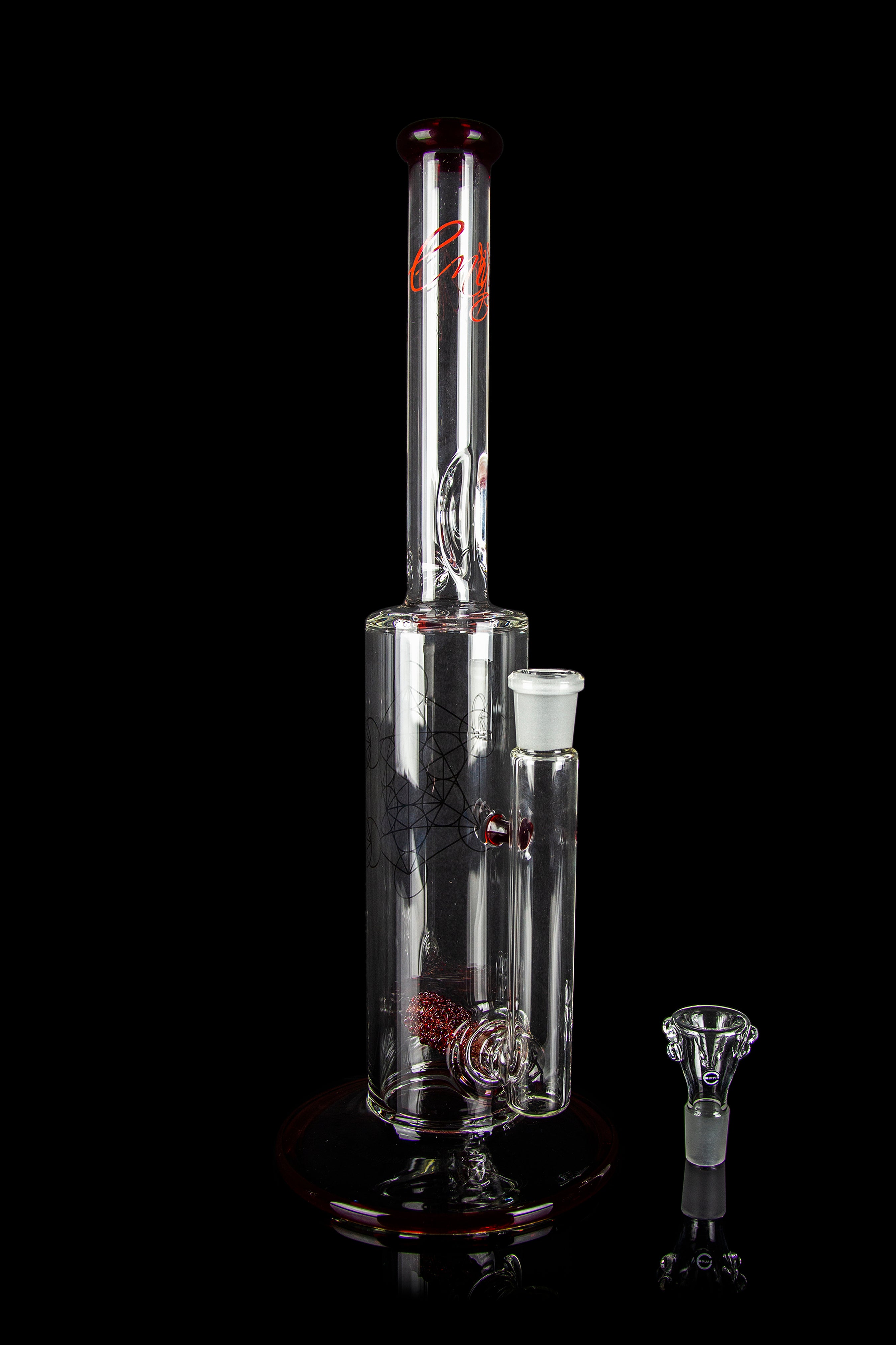Clear glass water pipe (bong) with red accents and a glass bowl, isolated on a black background.