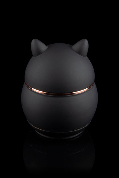 Sleek black cannabis storage jar with copper accents and cat-ear lid.