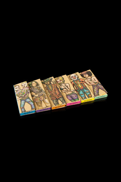 A studio shot of six colorful, illustrated rolling paper booklets labeled "So Leaves" against a black background. Each booklet features a unique character portrait.
