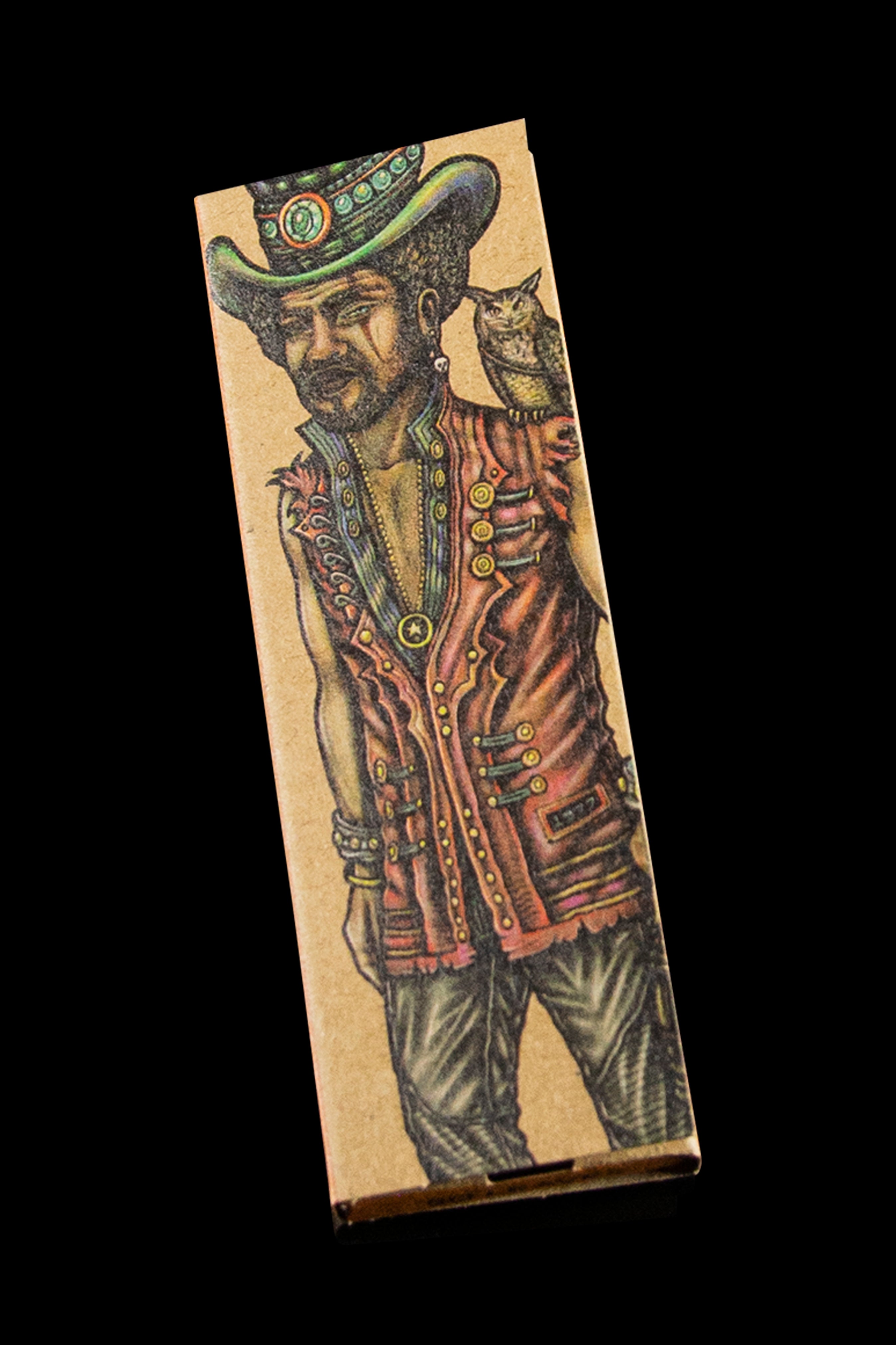 Cardboard packaging featuring a vintage-style illustration of a cowboy with an owl perched on his shoulder.