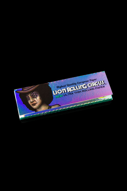 Pack of Lion Rolling Circus ultra-thin rolling papers with a vintage circus performer illustration against a black background.