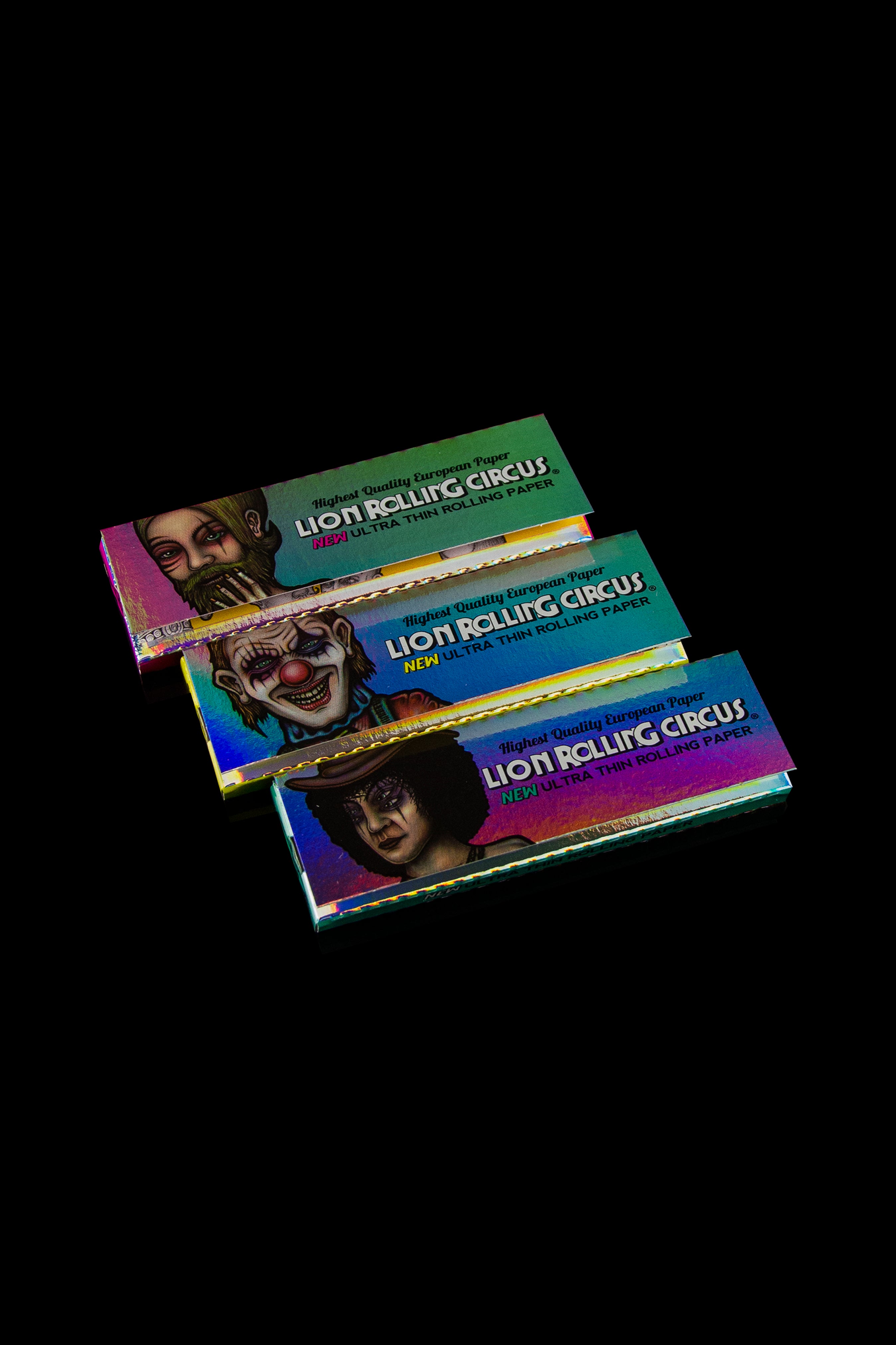 Three packs of “Lion Rolling Circus” rolling papers featuring circus clown imagery against a dark background.