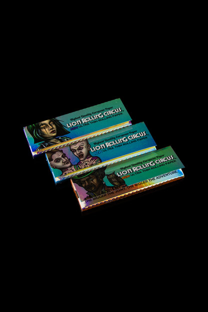 Three packs of Lion Rolling Circus ultra-thin rolling papers stacked against a dark background.