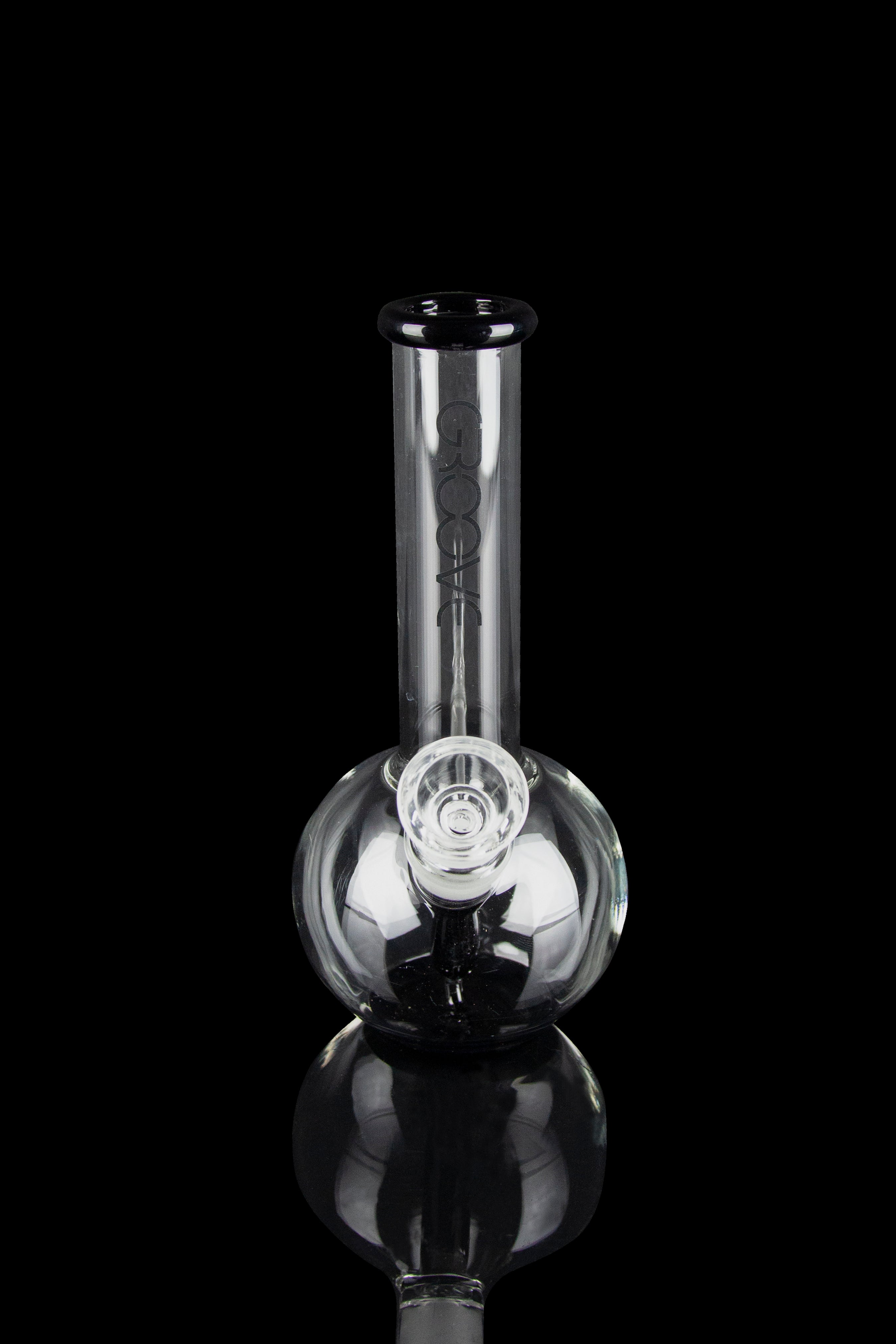 Clear glass bubbler water pipe with branding, isolated on black.