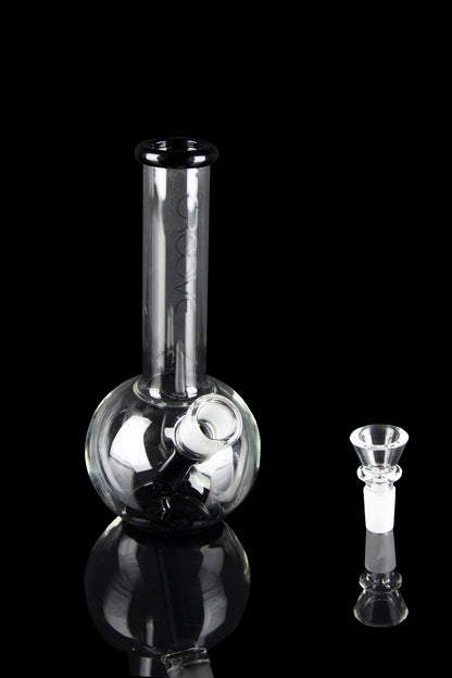 Glass bubbler and bowl for smoking cannabis, studio shot on black background.