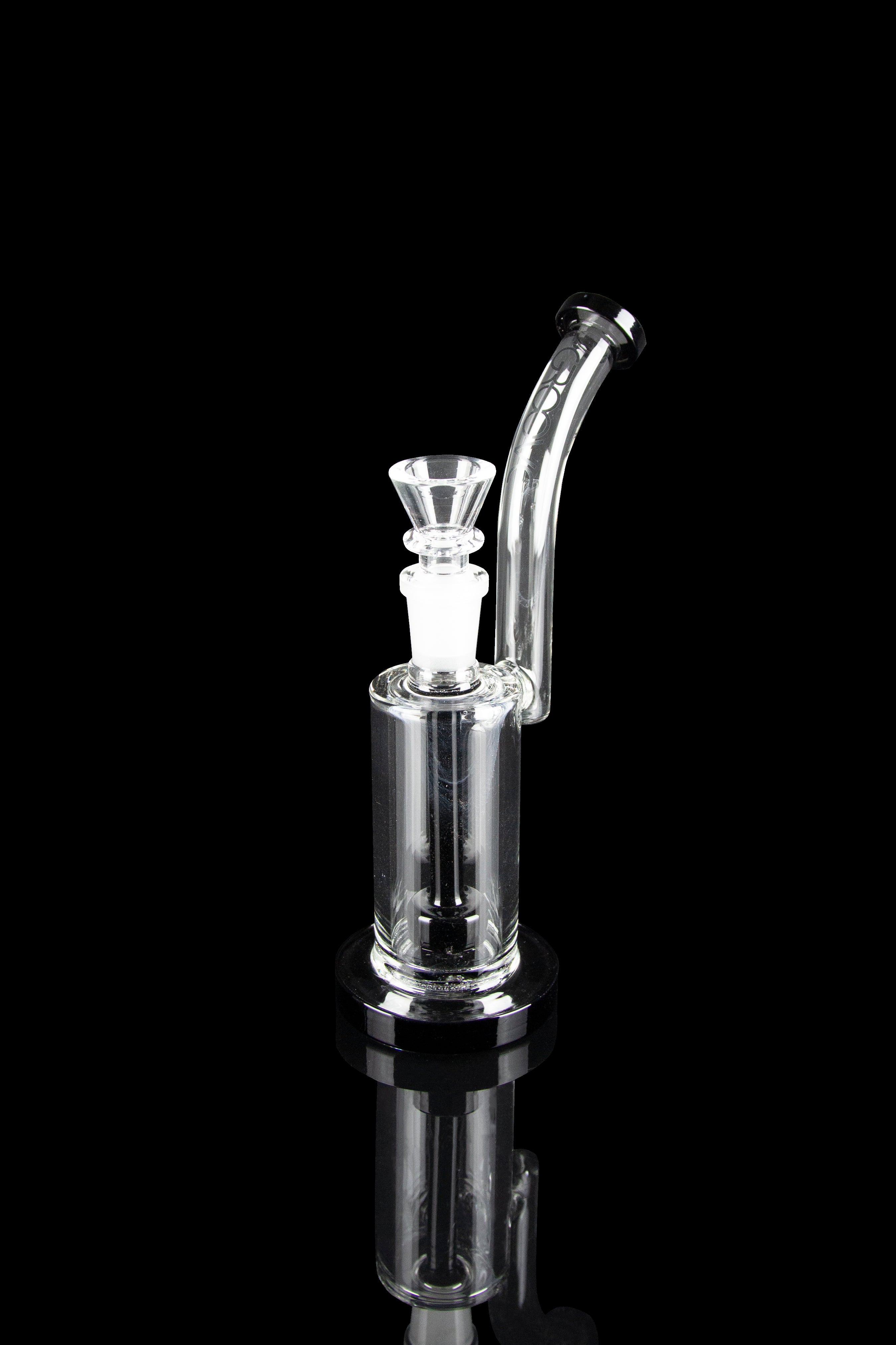 Clear glass bubbler with a bowl piece, reflecting on a black surface.
