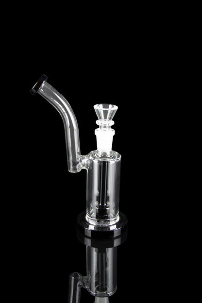 Clear glass bubbler with a curved mouthpiece and bowl, reflecting on a dark surface.