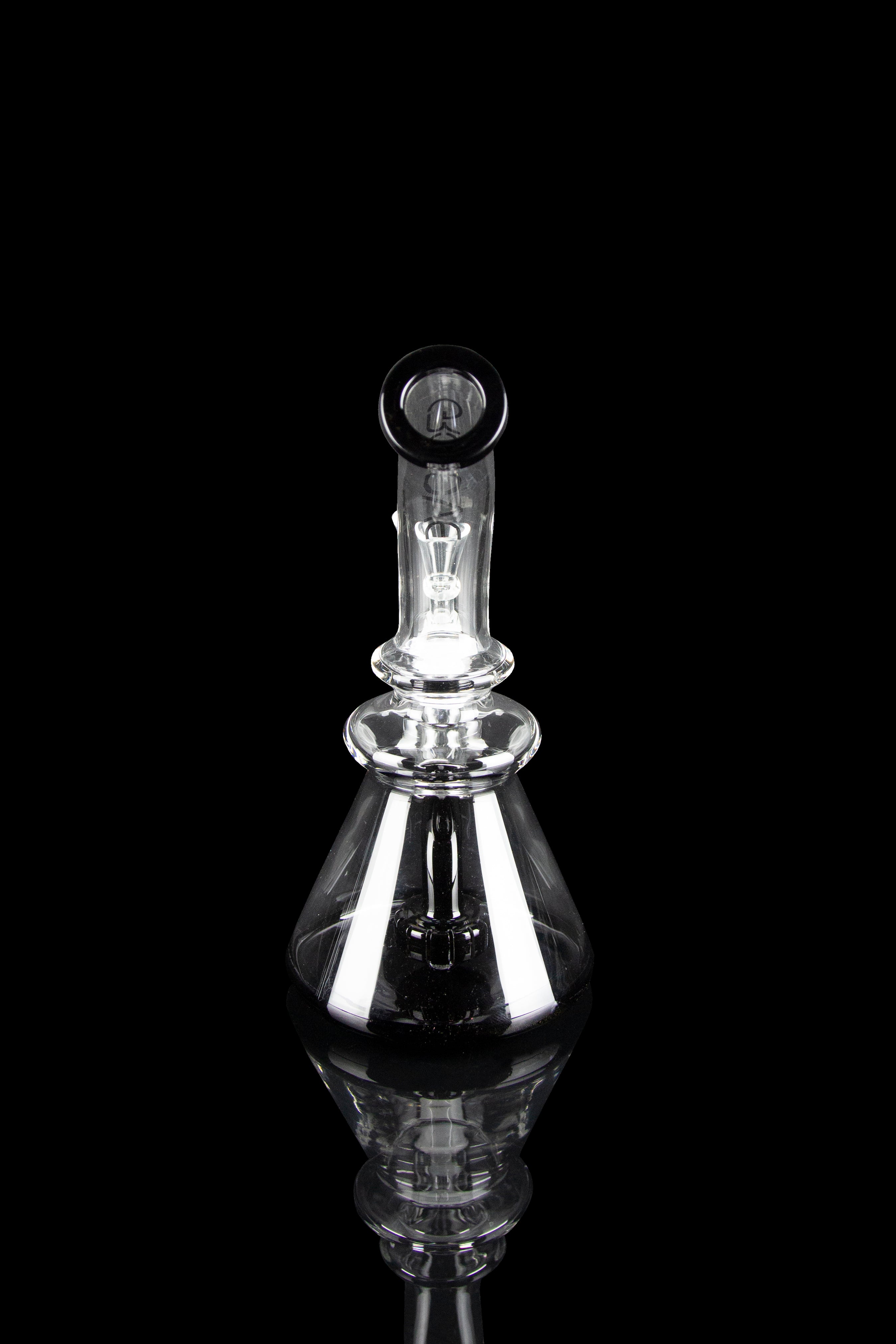 Clear glass dab rig with intricate detailing, isolated on black.