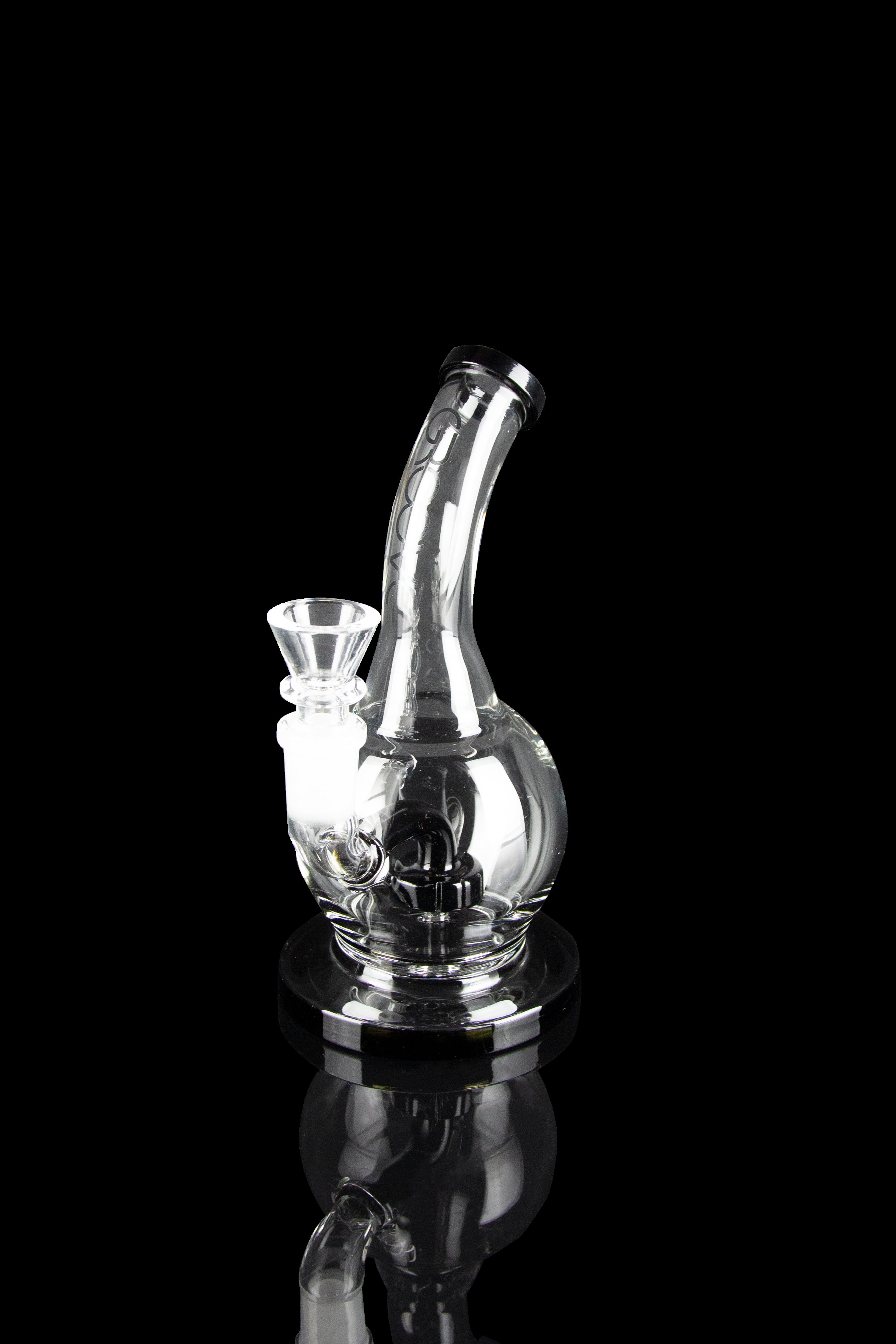 Clear glass water pipe (rig) with intricate bubbler design, isolated on black.