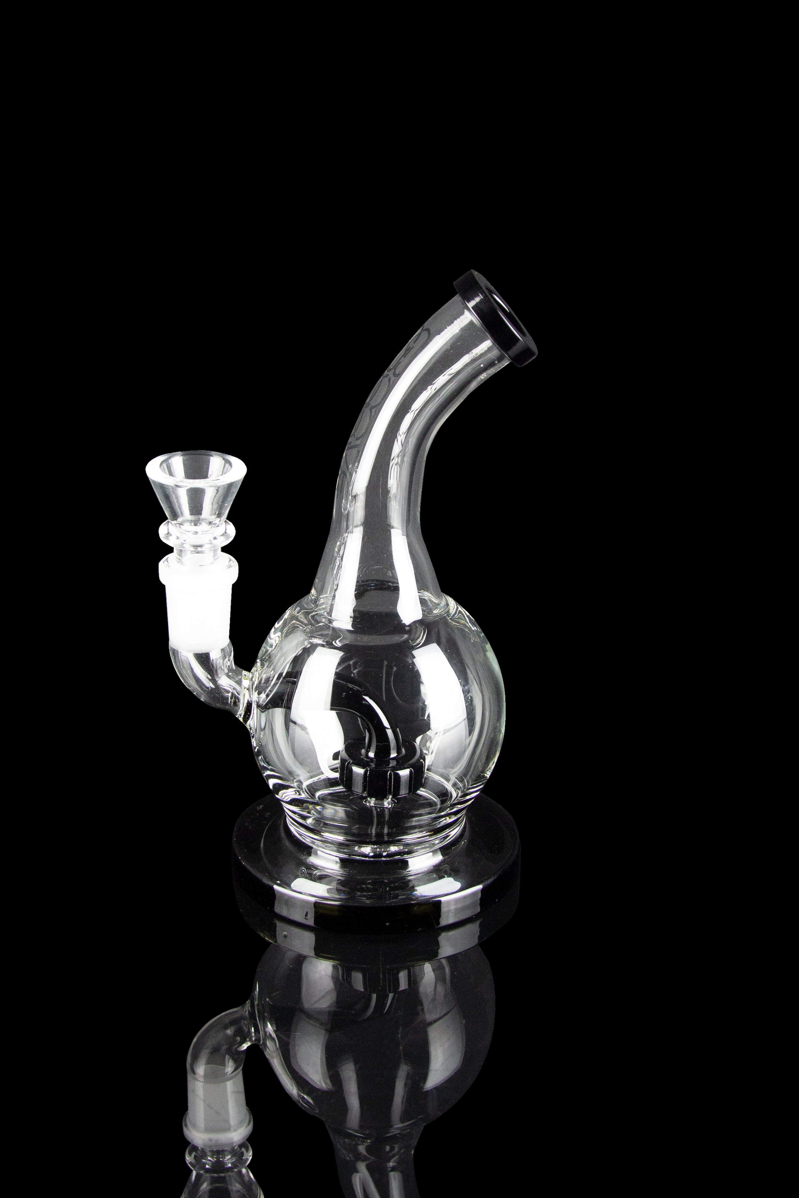 Clear glass water pipe (rig) with intricate bubbler design, isolated on black.