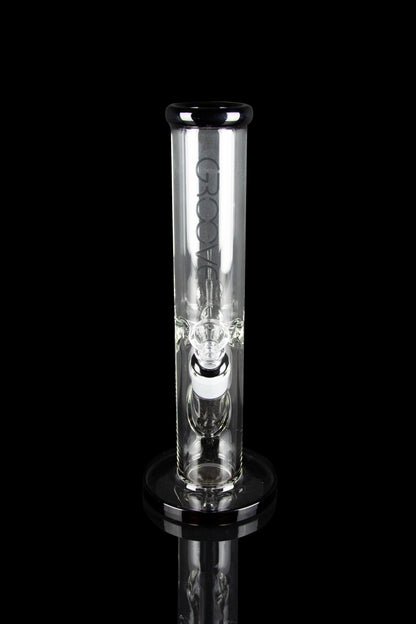 Clear glass water pipe with percolators, isolated on a black background.