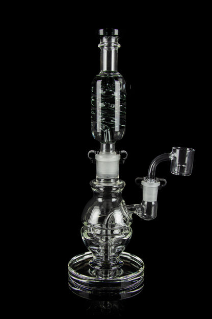 Clear glass water pipe (rig) with bubbler and quartz banger, isolated on a black background.