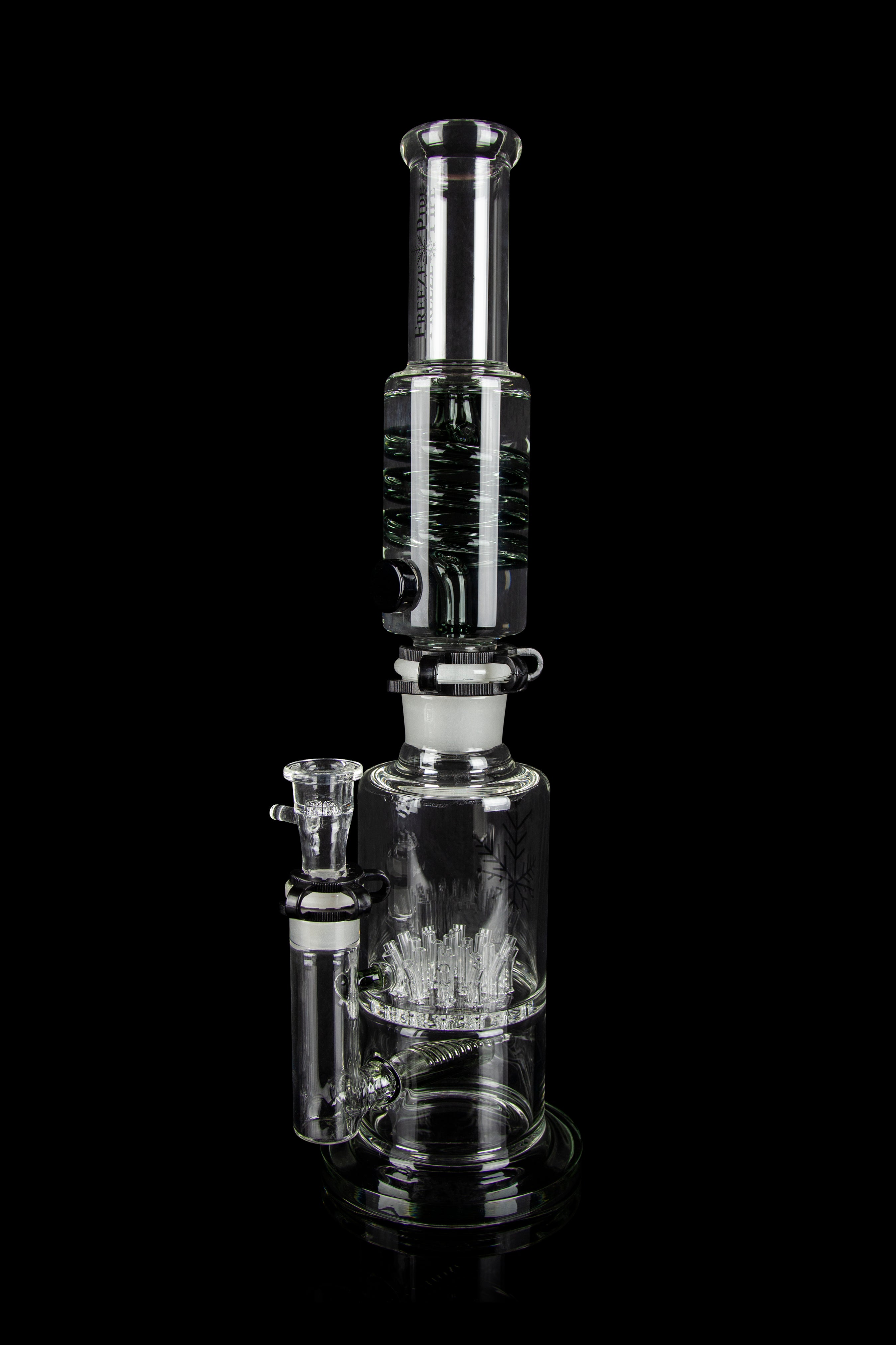 Clear glass water pipe (bong) with intricate percolator diffusion system, displayed against a black background.