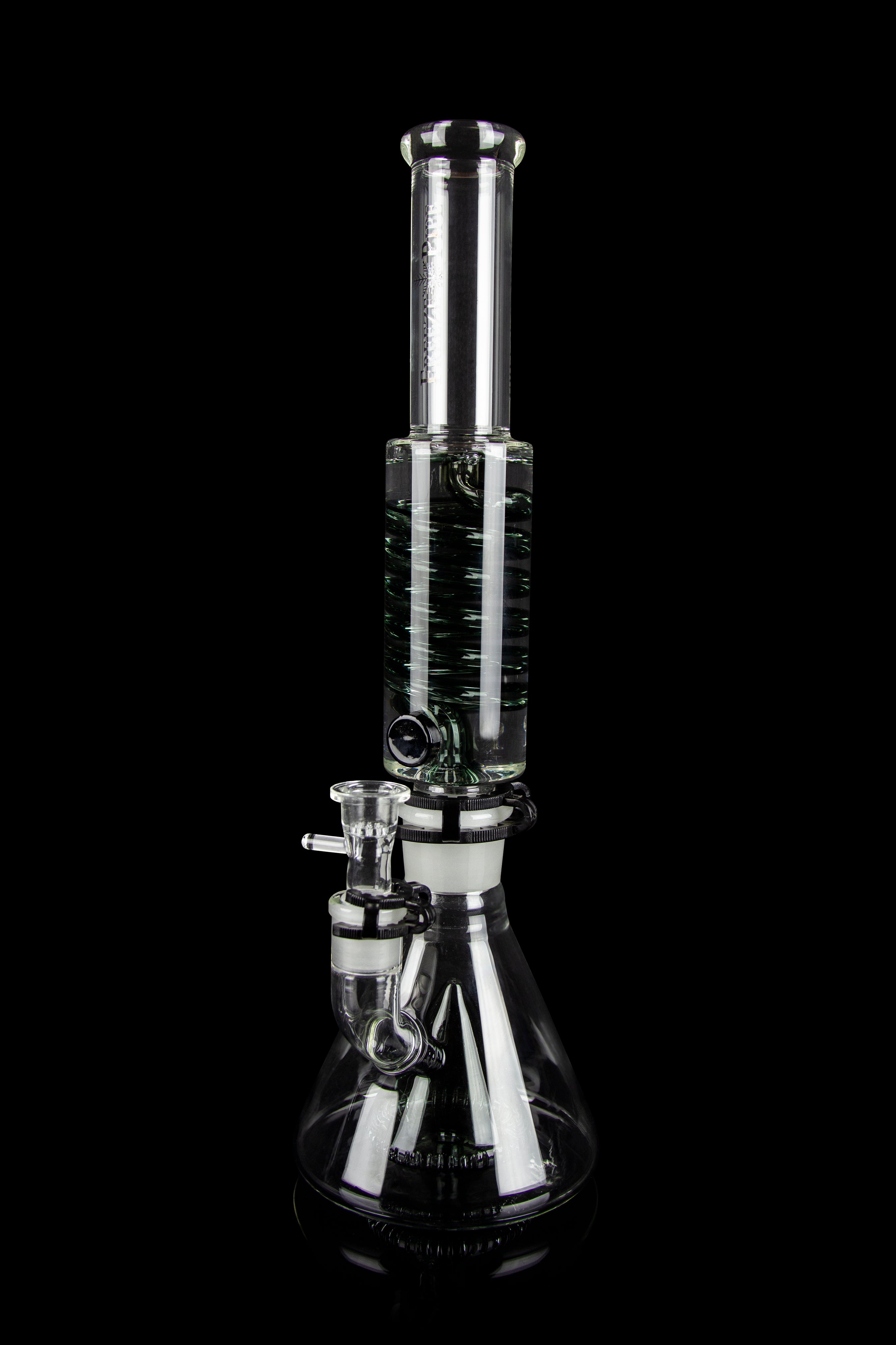Clear glass water pipe (bong) with intricate linear patterns, isolated on a black background.