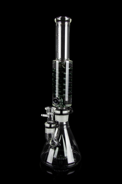 Clear glass water pipe (bong) with intricate linear patterns, isolated on a black background.
