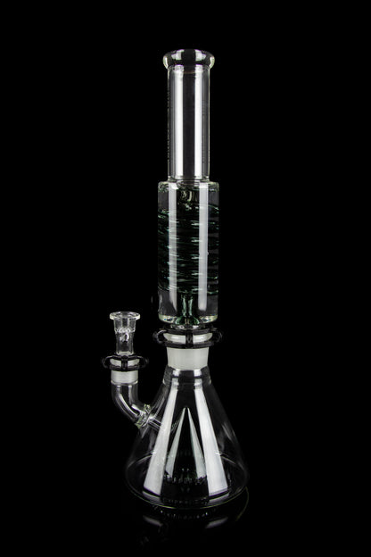Clear glass water pipe (bong) with intricate branching percolator, isolated on black.
