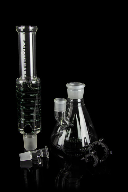 Glass water pipe (bong) and accessories on a black background.